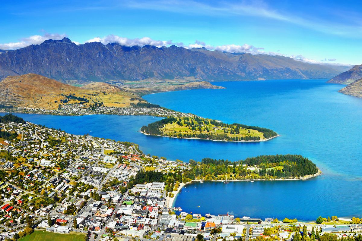 aerial view of queenstown new zealand with remarkables mountain range in background